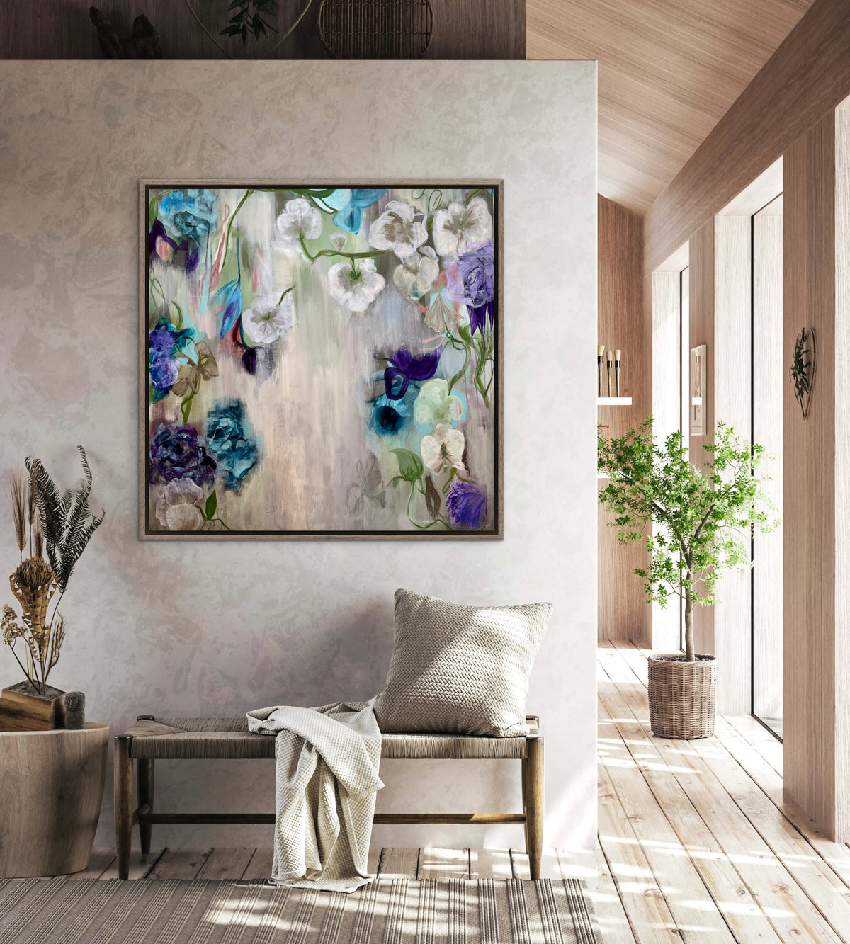 Framed floral wall art with blue, purple and white blooms on light canvas background