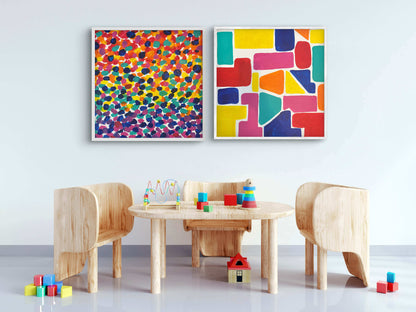Children's play area with wooden furniture, colorful blocks, and abstract art on a white wall.