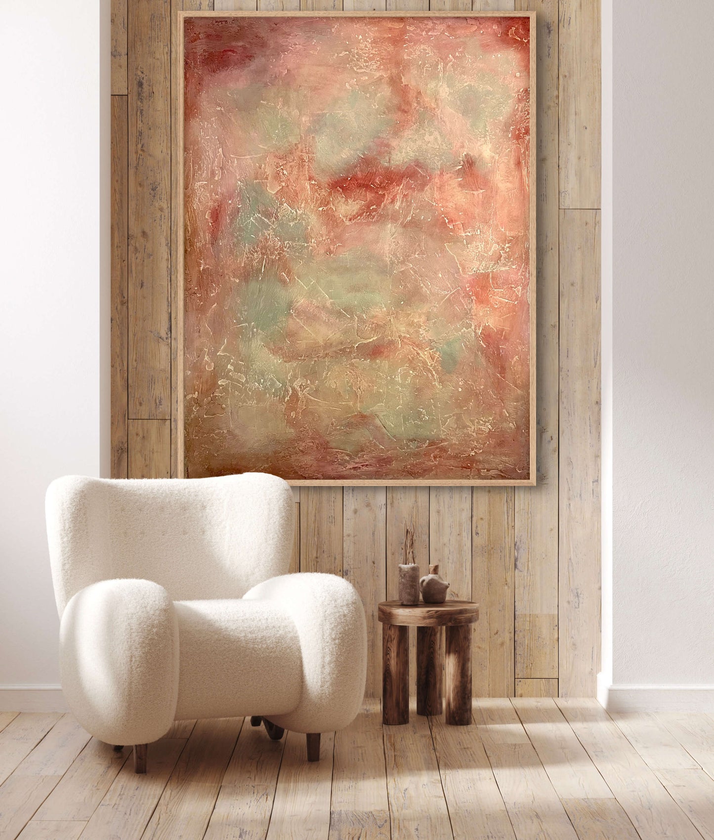 White armchair in a room with a large abstract painting on a wooden wall.